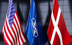 A group of flags on a wall<br><br>Description automatically generated