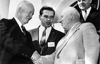 A group of men in suits shaking hands

Description automatically generated