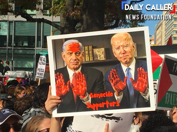 A group of people holding a poster
Description automatically generated