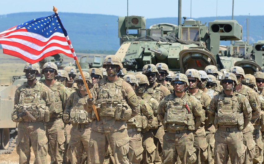A group of soldiers holding a flag<br><br>Description automatically generated
