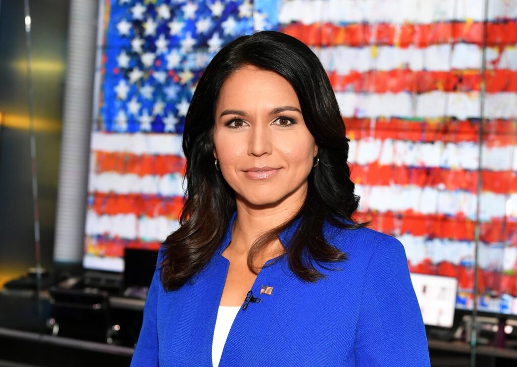 A person in a blue jacket Description automatically generated