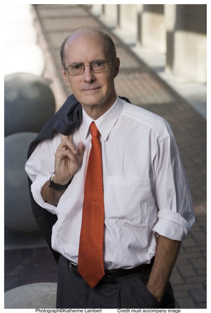A person in a white shirt and red tie

Description automatically generated