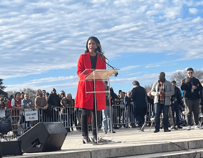 A person speaking at a podium Description automatically generated