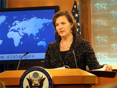 A person standing at a podium

Description automatically generated