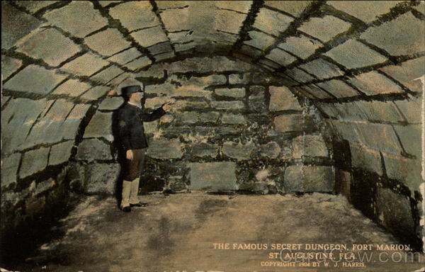 A person standing in a stone tunnel

Description automatically generated