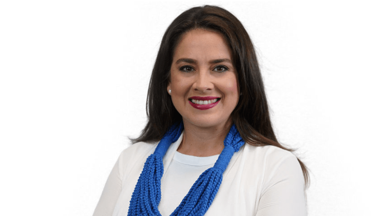 A person wearing a blue scarf

Description automatically generated