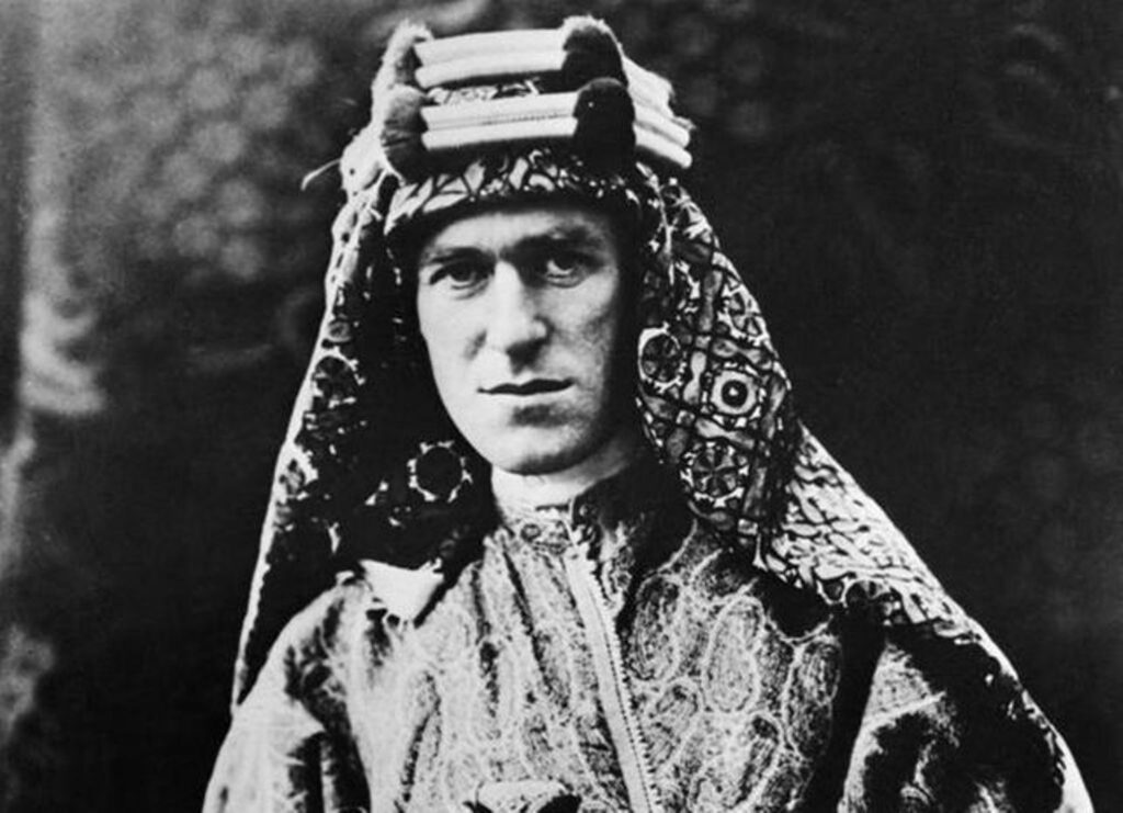 A person wearing a headdress

Description automatically generated