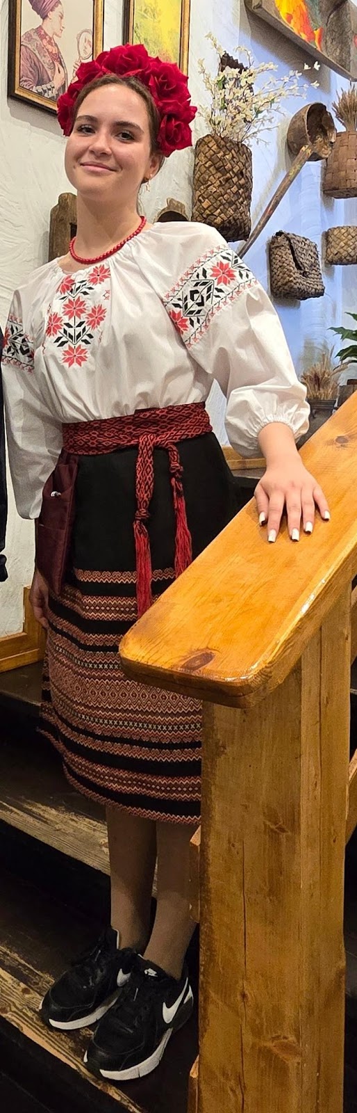 A person wearing a white shirt and black skirt

Description automatically generated