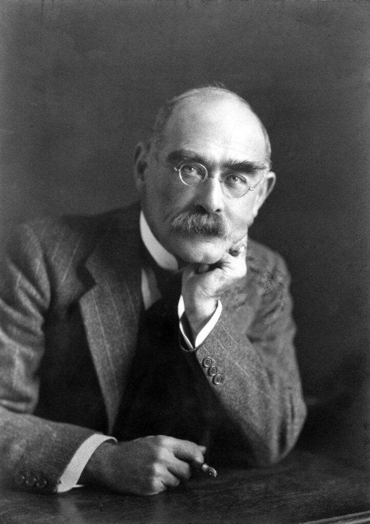 A person with a mustache and glasses

Description automatically generated
