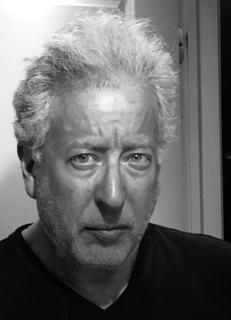 A person with grey hair

Description automatically generated