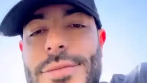 Reuters Sebastian Marset, a suspected Uruguayan drug trafficker, makes a statement thanking the director of the Bolivian Special Force to Fight Drug Trafficking (FELCN) for tipping him off, which allowed him to escape arrest, in this still image obtained from social media video taken at an unknown location and released August 2, 2023