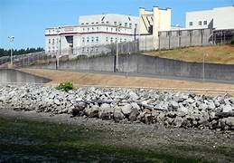 A building behind a fence

Description automatically generated