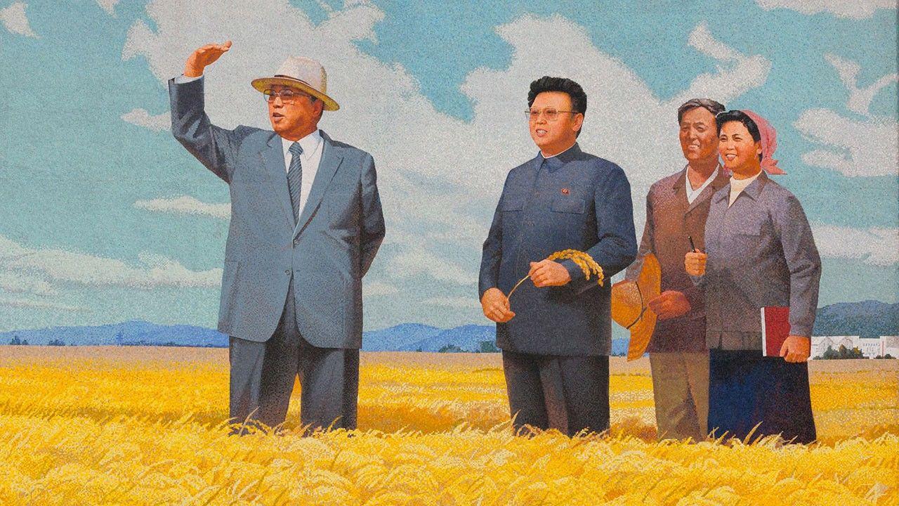 A group of men standing in a field

Description automatically generated