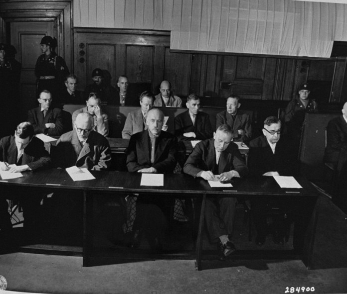 A group of people sitting at a table Description automatically generated