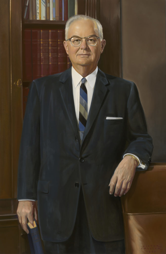 A person in a suit and tie
Description automatically generated