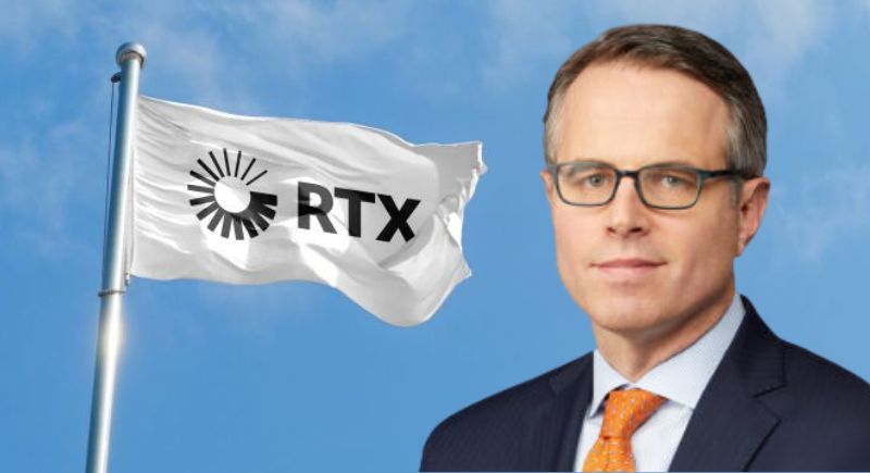 A person in a suit and tie holding a flag

Description automatically generated