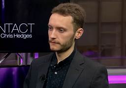A person in a suit

Description automatically generated