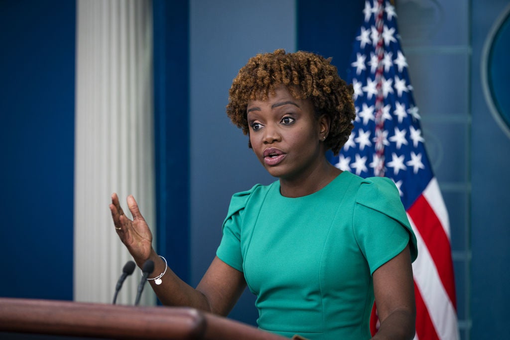 A person speaking at a podium
Description automatically generated