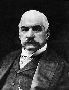 A person with a mustache
Description automatically generated