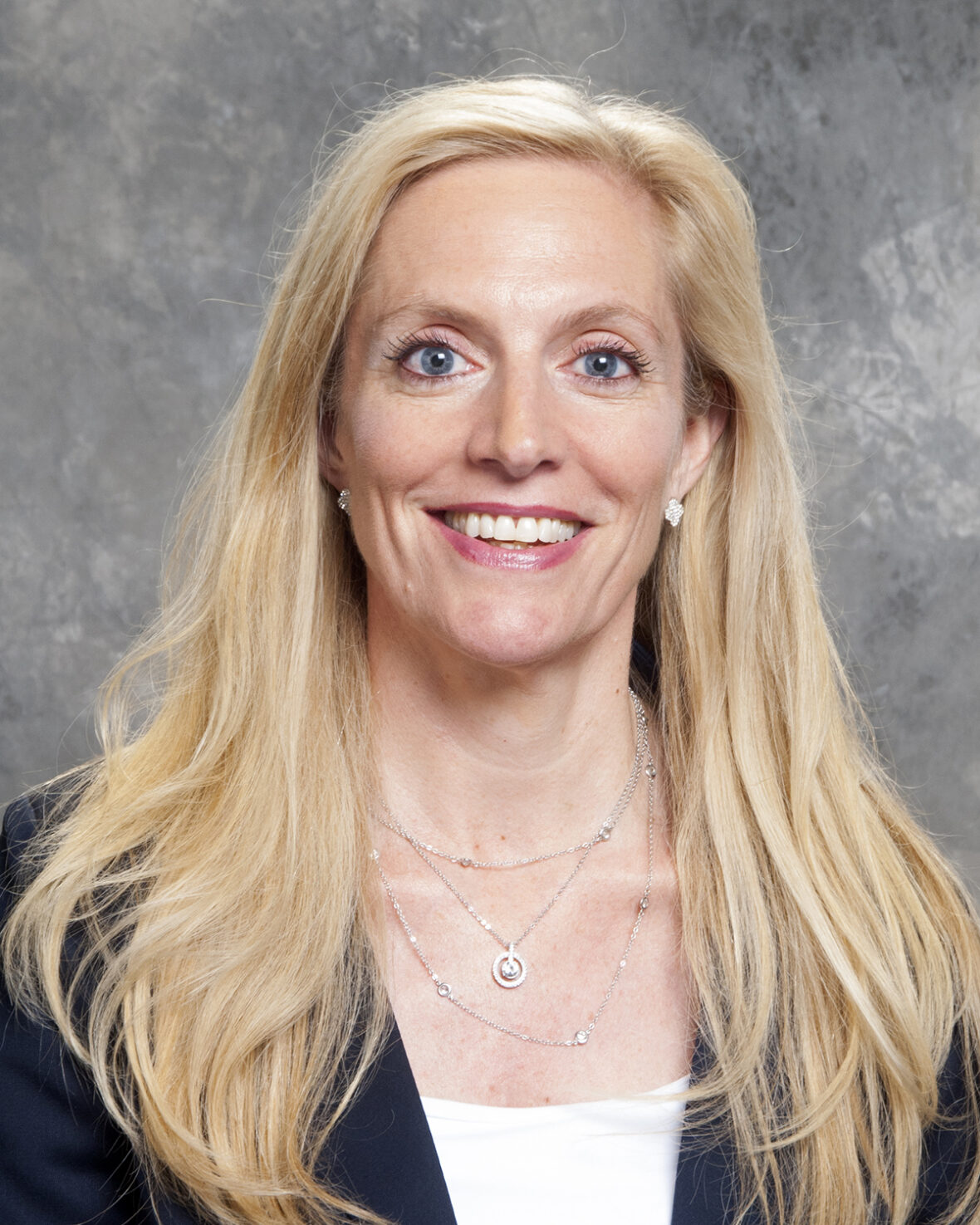 A person with long blonde hair
Description automatically generated