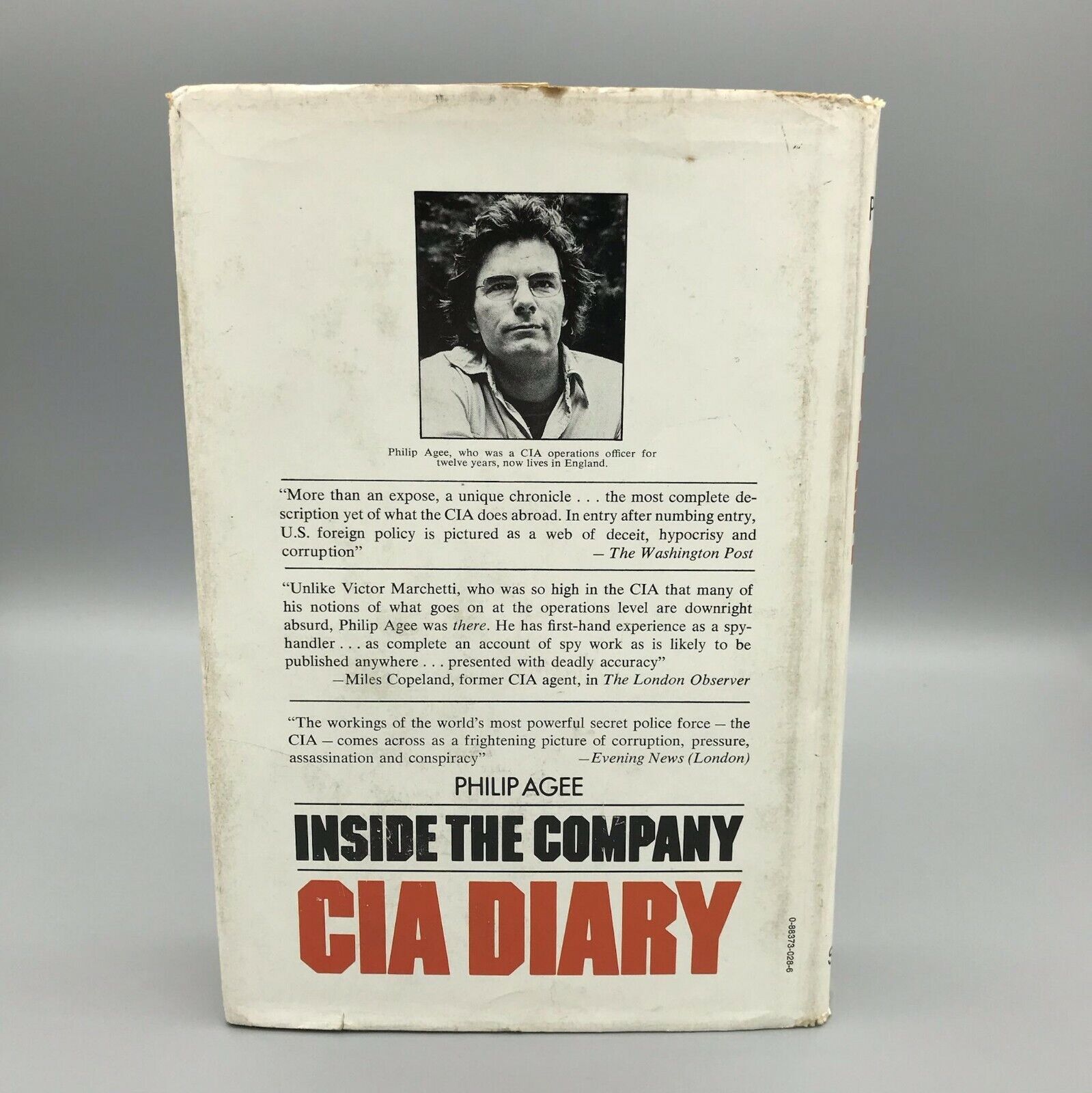 A white book with a person's face on it

Description automatically generated