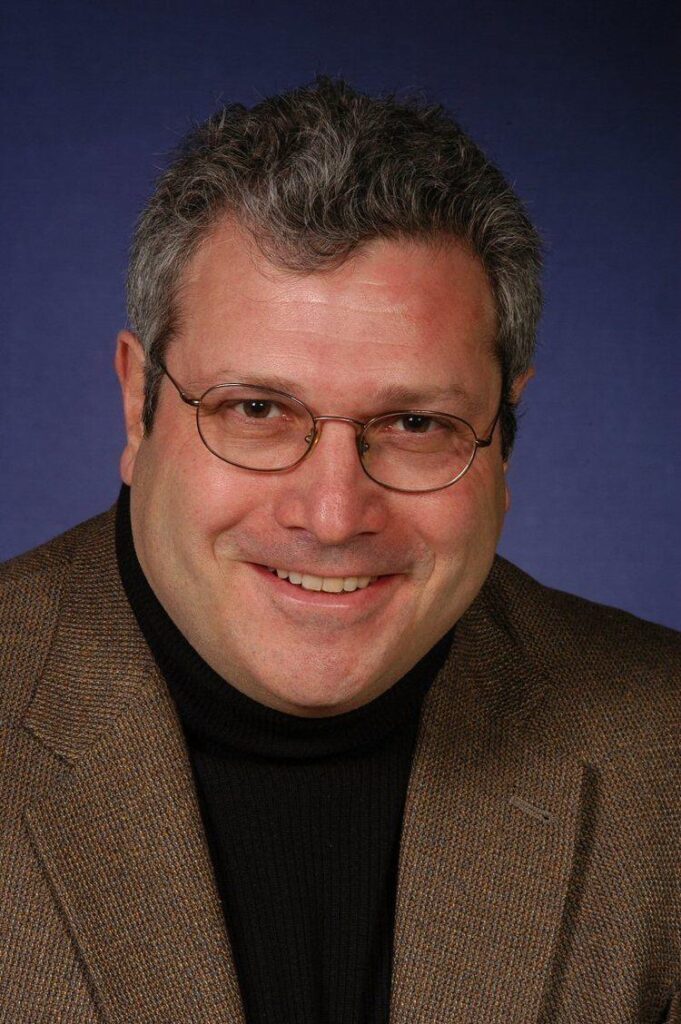 A close-up of a person smiling

AI-generated content may be incorrect.