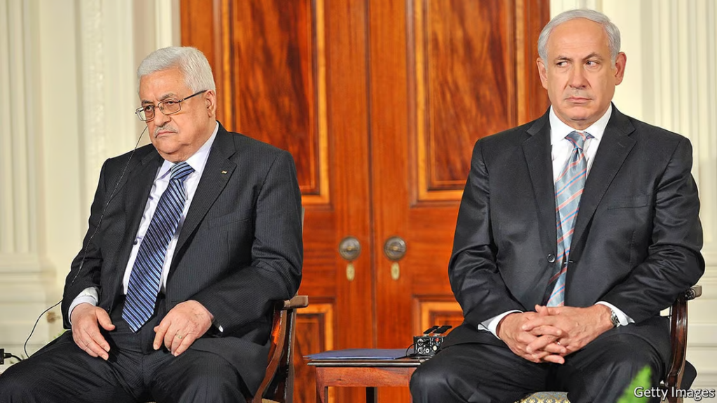 A couple of men sitting in chairs Description automatically generated