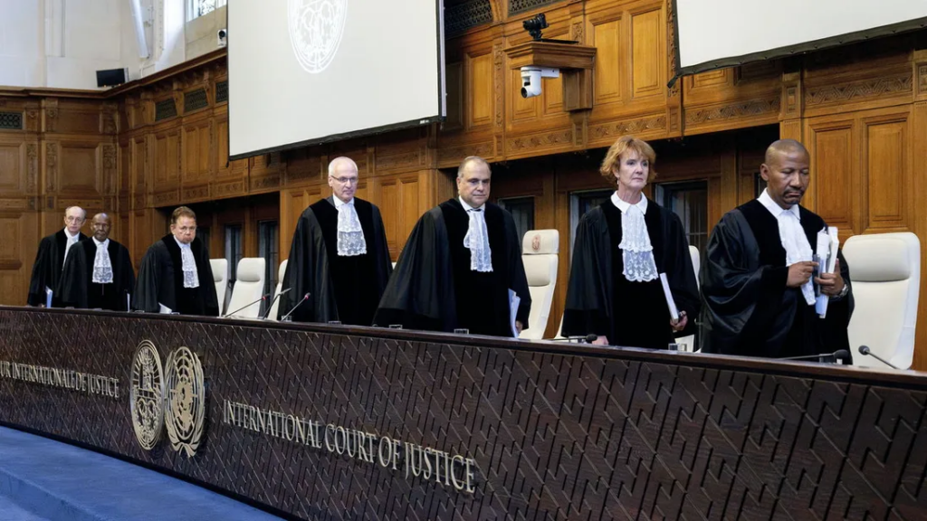A group of people in black robes Description automatically generated