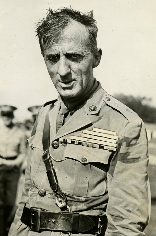 A person in a military uniform

Description automatically generated