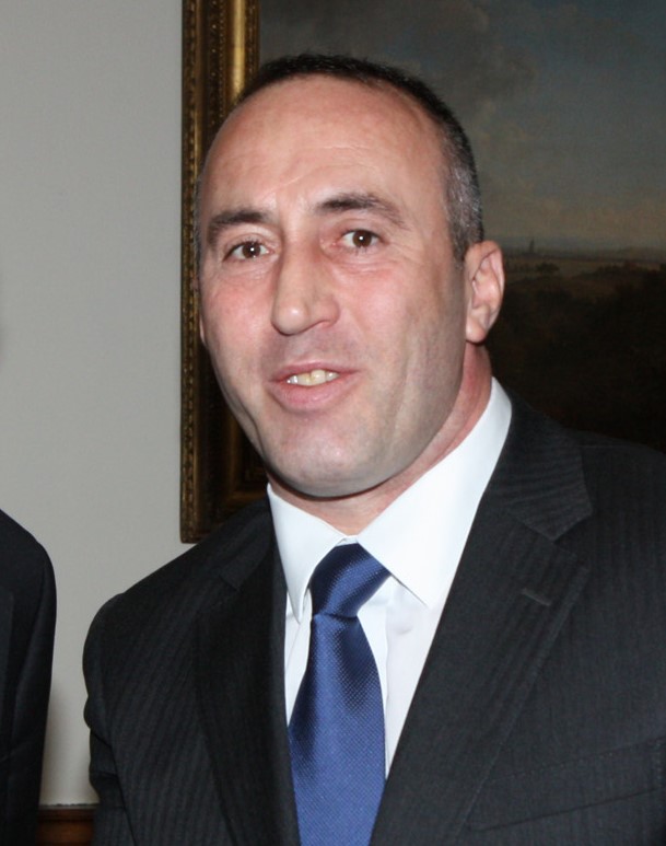 A person in a suit and tie

Description automatically generated
