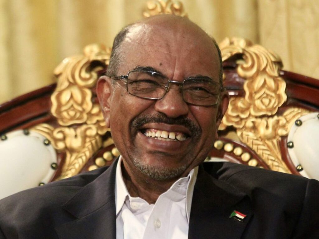 A person smiling at the camera

Description automatically generated