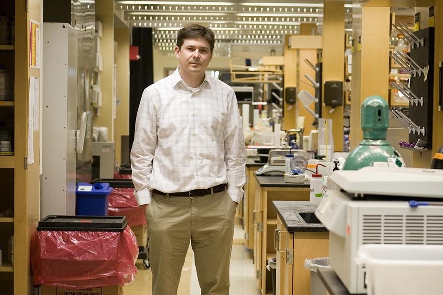 A person standing in a lab
Description automatically generated