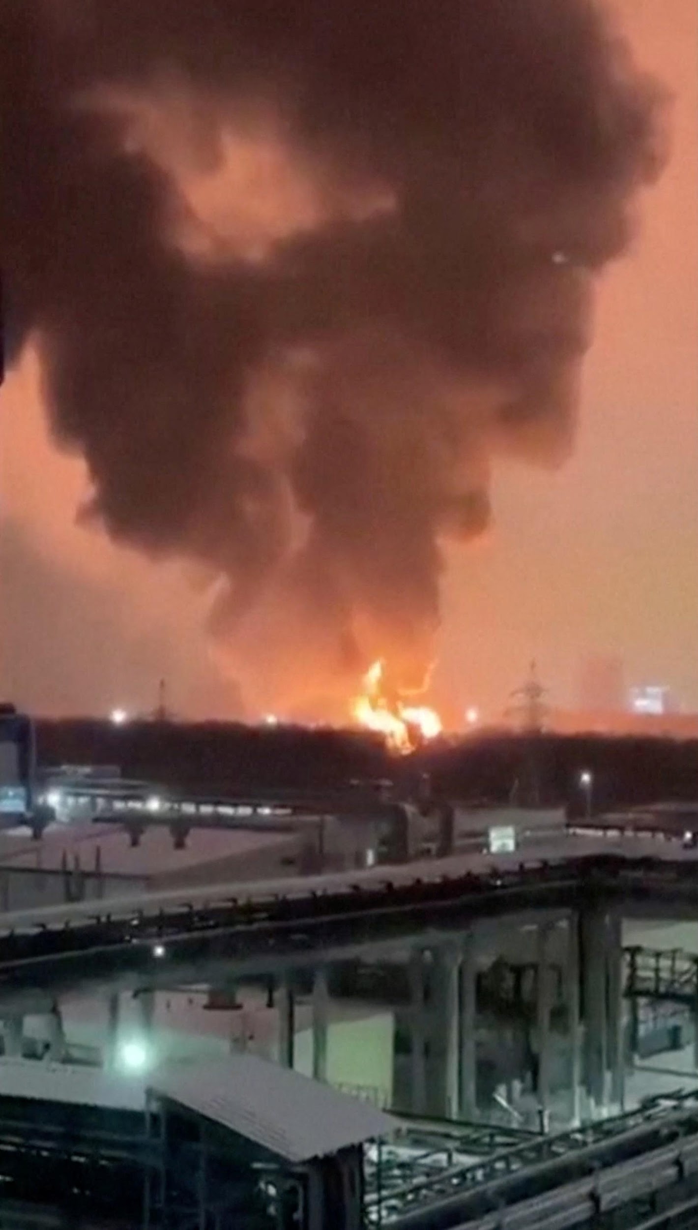 Smoke and flames rise from a fire after an explosion near an industrial site in Kazan