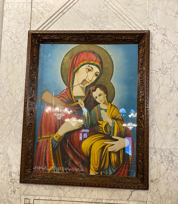 A framed picture of a person and child

AI-generated content may be incorrect.