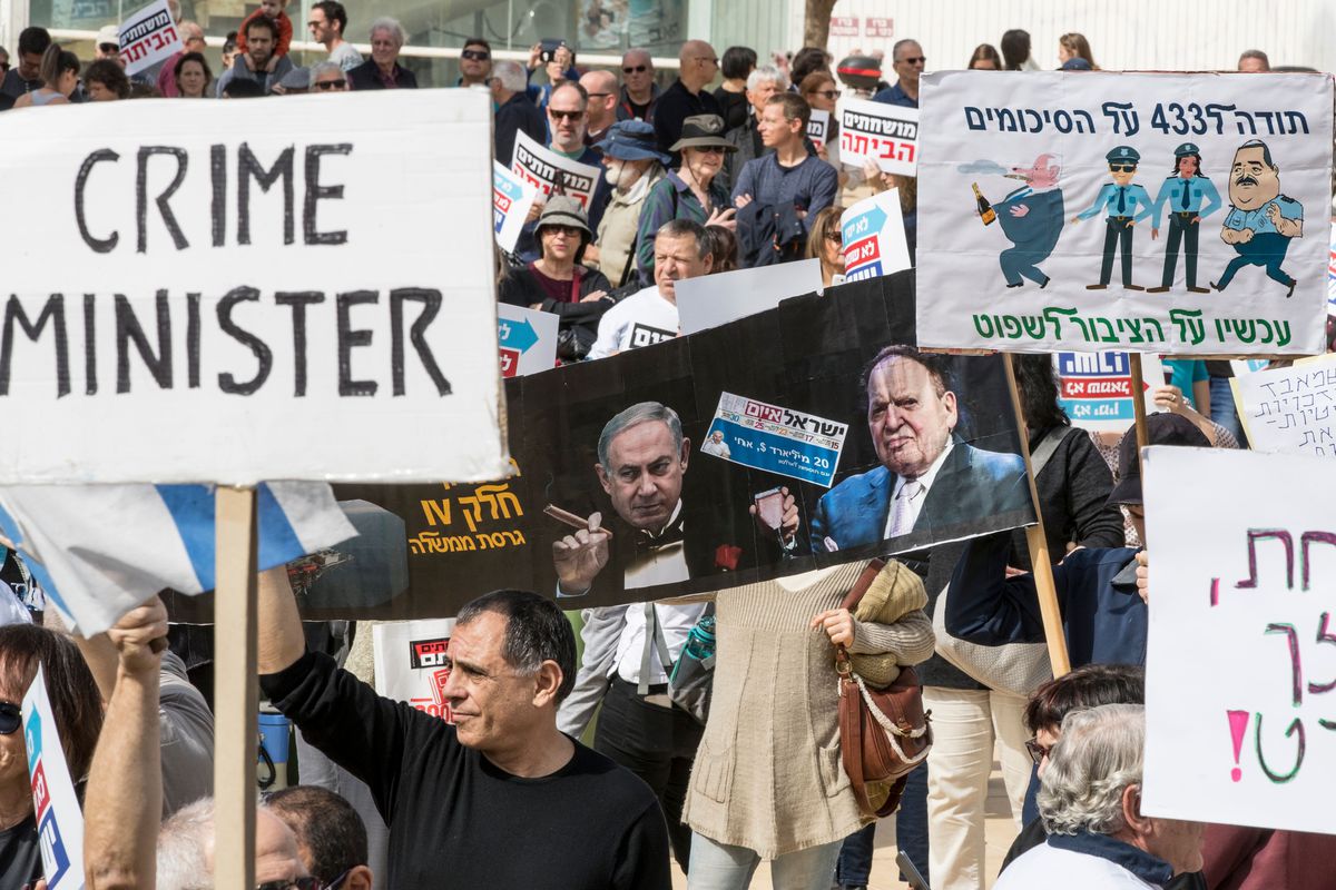 A group of people holding signs

Description automatically generated