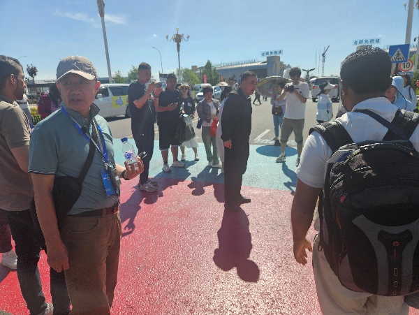 A group of people standing on a street AI-generated content may be incorrect.