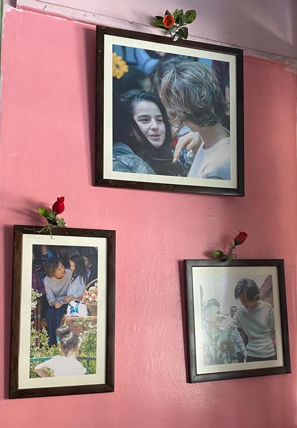 A group of pictures on a pink wall

AI-generated content may be incorrect.