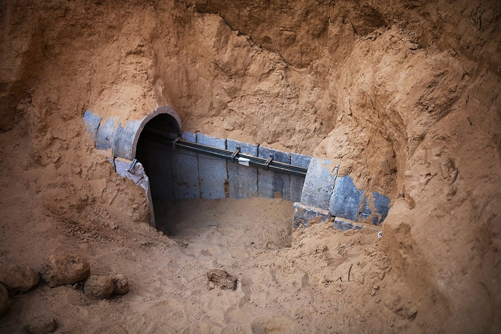 A hole in the ground with a pipe Description automatically generated