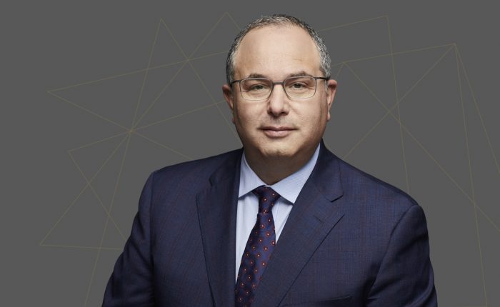 A person in a suit and tie

AI-generated content may be incorrect.