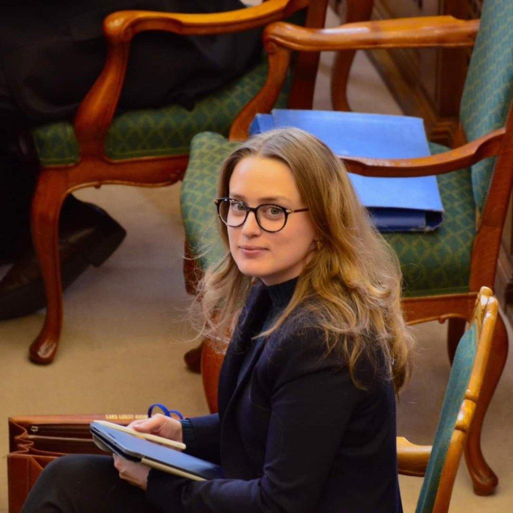 A person sitting in a chair AI-generated content may be incorrect.