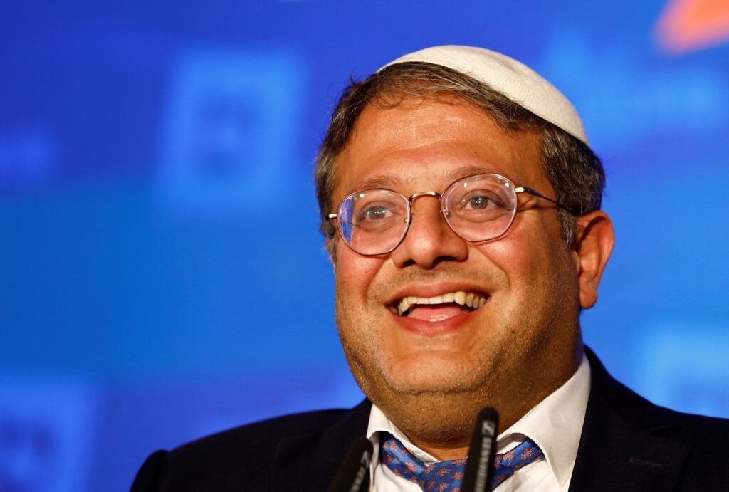 A person wearing a white hat and glasses Description automatically generated
