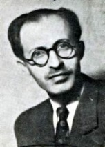 A person wearing glasses and a suit

Description automatically generated