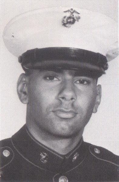 A close-up of a person in a uniform

Description automatically generated