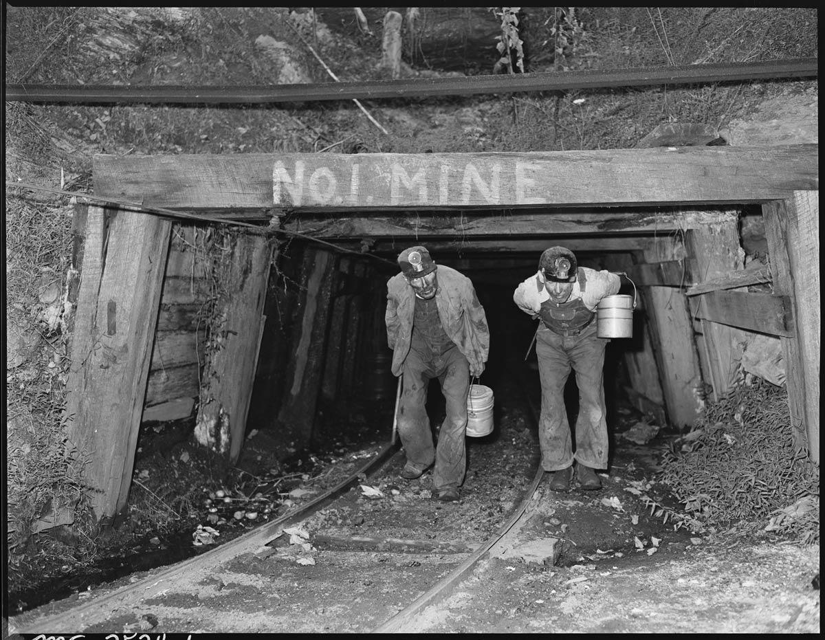 A few men carrying buckets in a tunnel

AI-generated content may be incorrect.