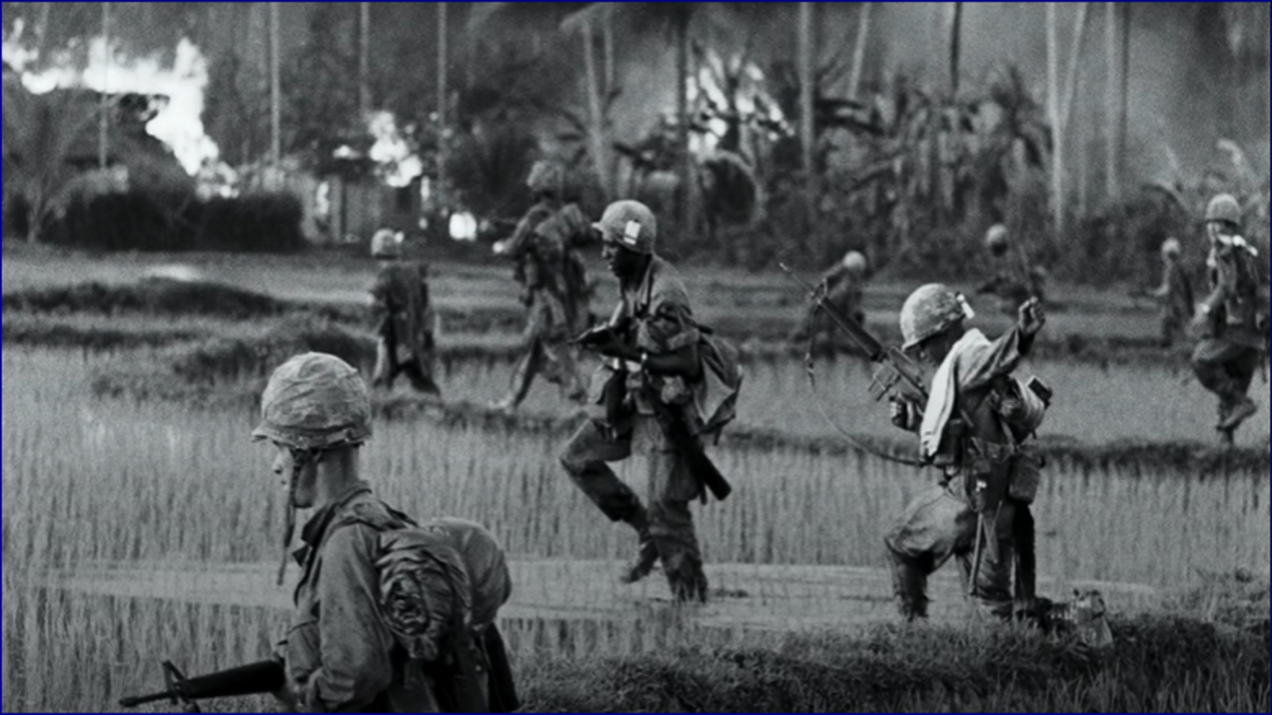 A group of soldiers running in a field

Description automatically generated