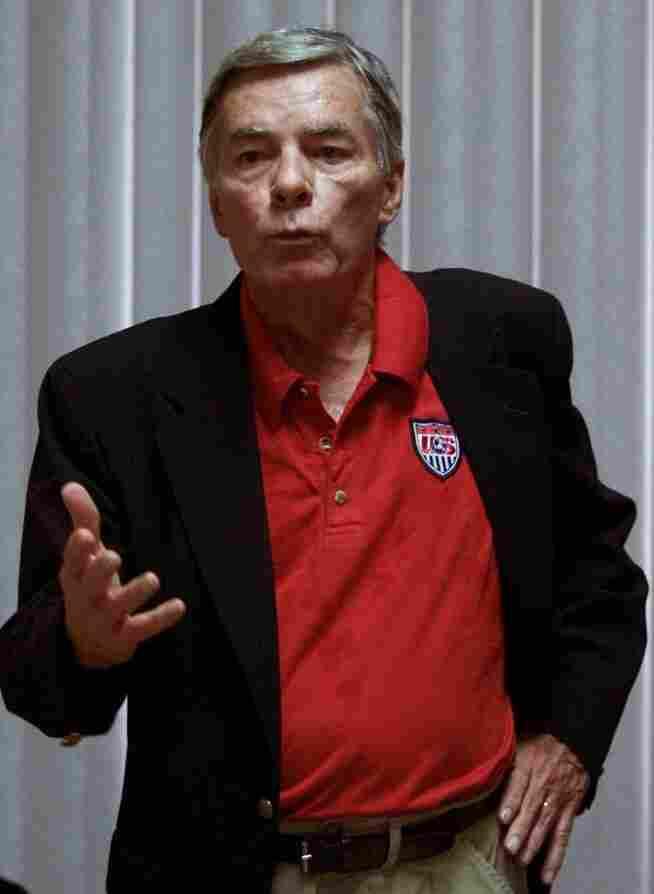 A person in a red shirt and black jacket

AI-generated content may be incorrect.