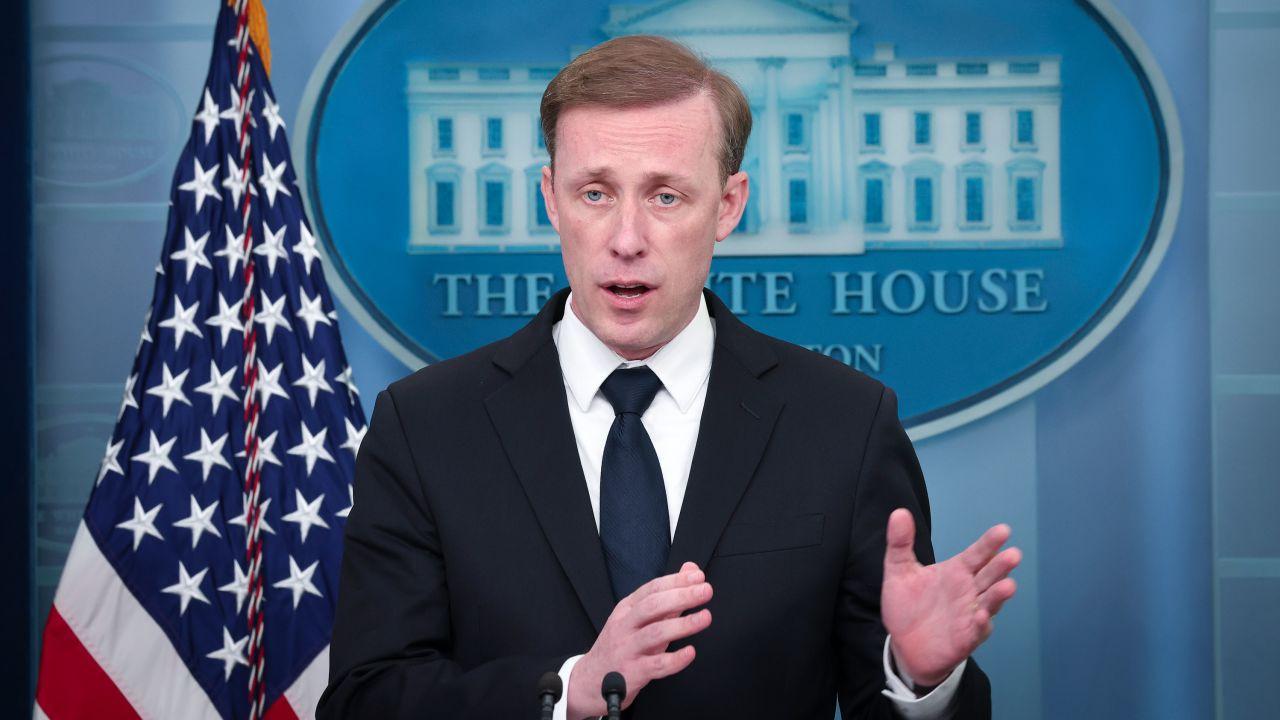 A person in a suit and tie speaking in front of a flag
AI-generated content may be incorrect.