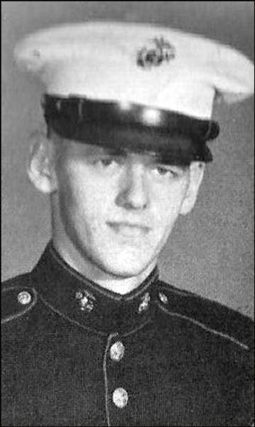 A person in uniform with a white hat

Description automatically generated