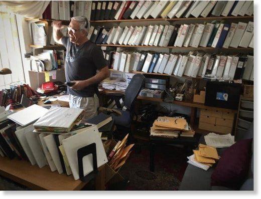 A person standing in a room with many books
AI-generated content may be incorrect.
