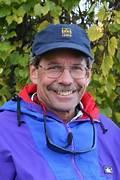 A person wearing a hat and glasses

Description automatically generated